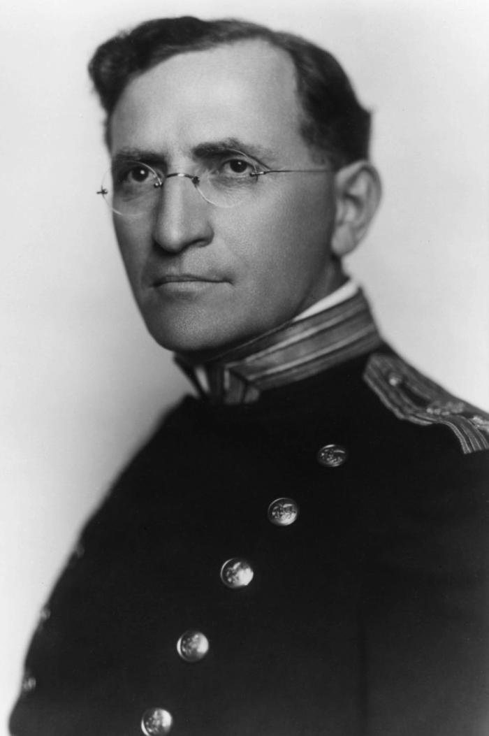 Black and white photo of a man in a uniform